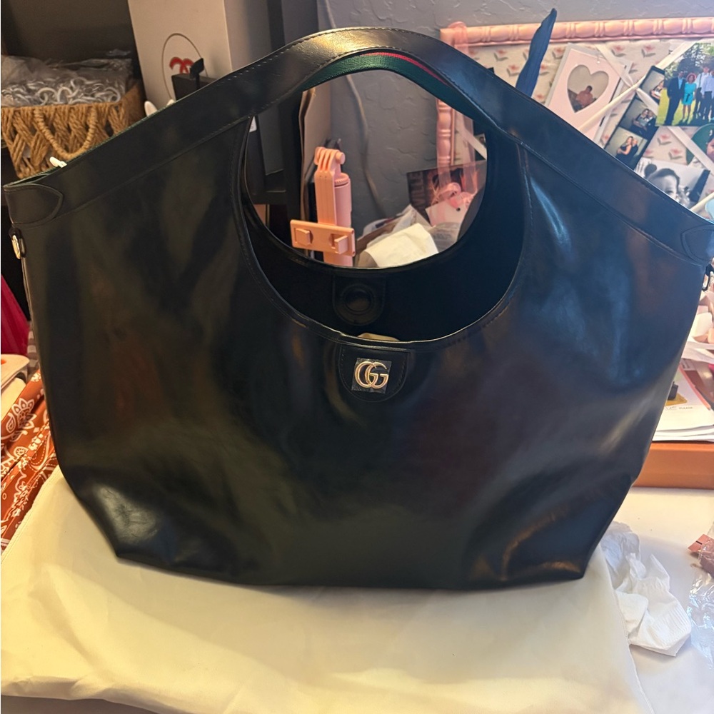 New. Black leather gigolo tote.